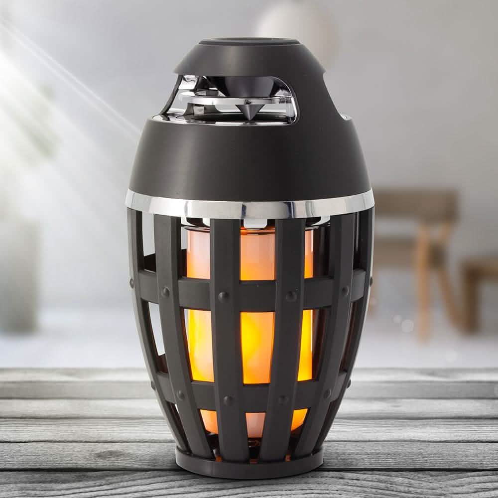 Altavoz estéreo portátil inalámbrico y lámpara de mesa con efecto de llama Tiki Torch