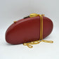 Oval Hardcase Clutch Bag with Two-Tone Metal Clasp