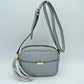 Pebbled Camera Crossbody Bag with Large Statement Tassel Accent