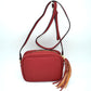 Pebbled Camera Crossbody Bag with Large Statement Tassel Accent