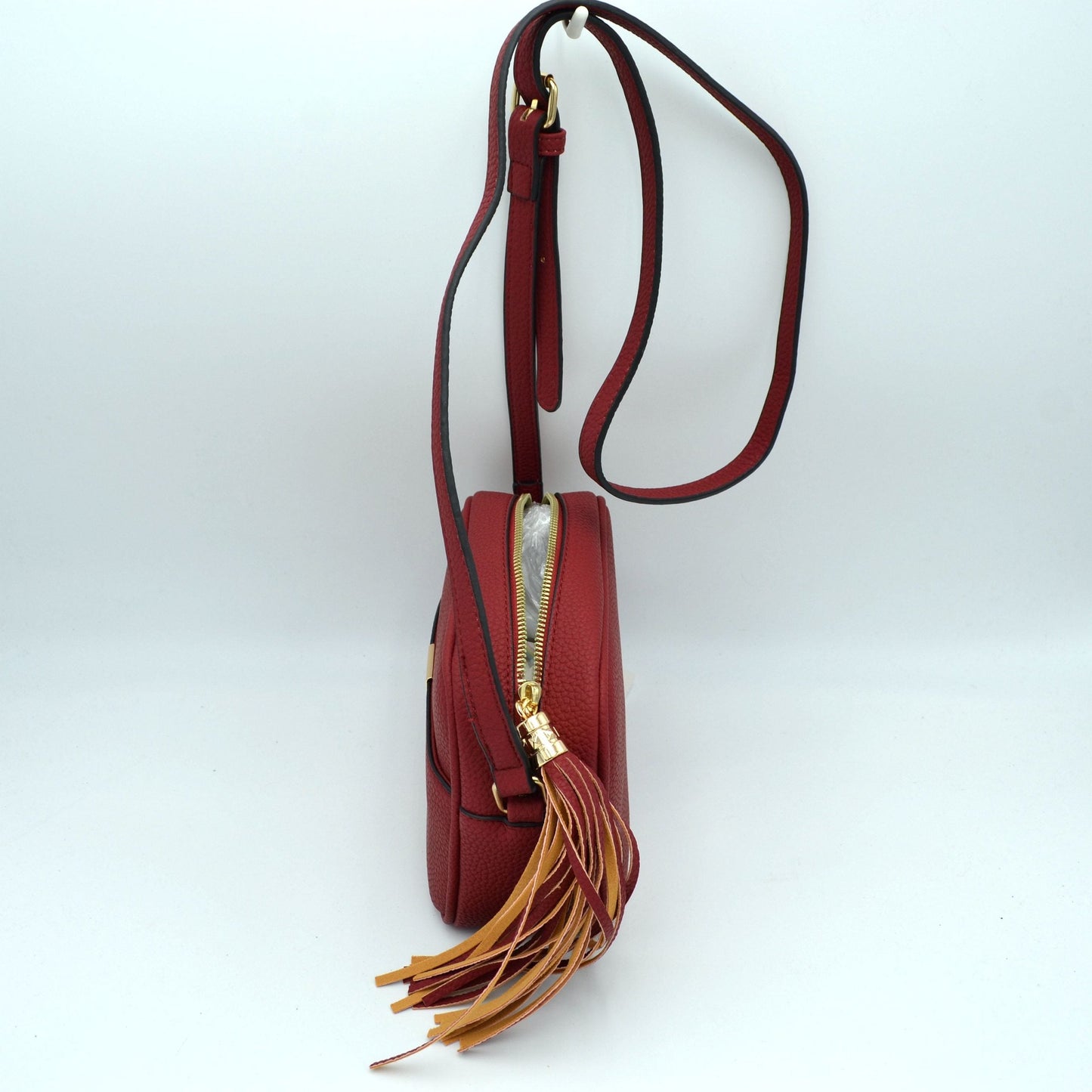 Pebbled Camera Crossbody Bag with Large Statement Tassel Accent