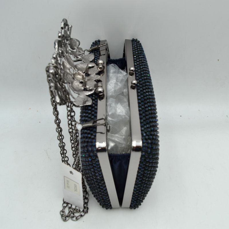 Studded Evening Clutch with Ornate Leaf Clasp Detail