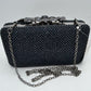Studded Evening Clutch with Ornate Leaf Clasp Detail