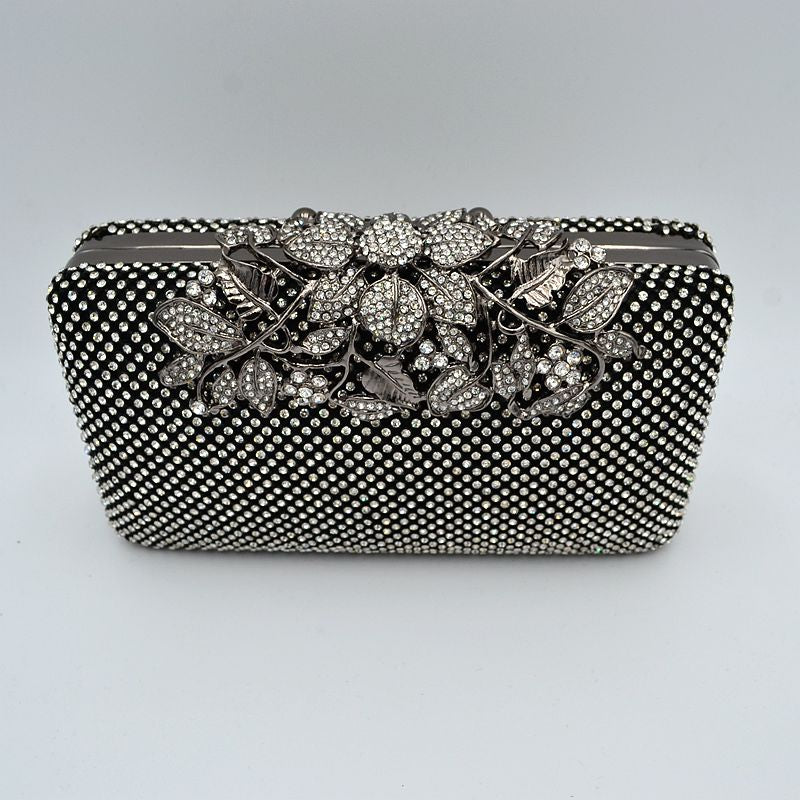 Studded Evening Clutch with Ornate Leaf Clasp Detail