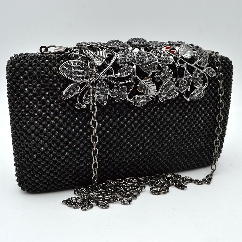 Studded Evening Clutch with Ornate Leaf Clasp Detail