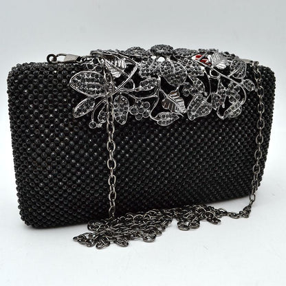 Studded Evening Clutch with Ornate Leaf Clasp Detail