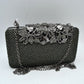 Studded Evening Clutch with Ornate Leaf Clasp Detail