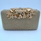 Studded Evening Clutch with Ornate Leaf Clasp Detail