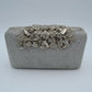 Studded Evening Clutch with Ornate Leaf Clasp Detail
