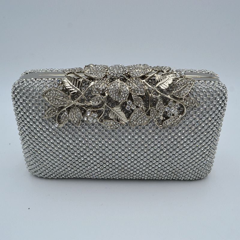 Studded Evening Clutch with Ornate Leaf Clasp Detail