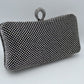 Shimmering Studded Clutch Bag with Textured O-Ring Clasp