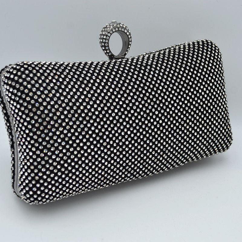 Shimmering Studded Clutch Bag with Textured O-Ring Clasp