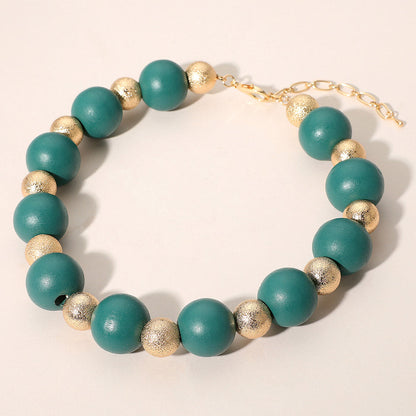 Collar llamativo de cuentas de metal con bolas texturizadas de madera audaces
