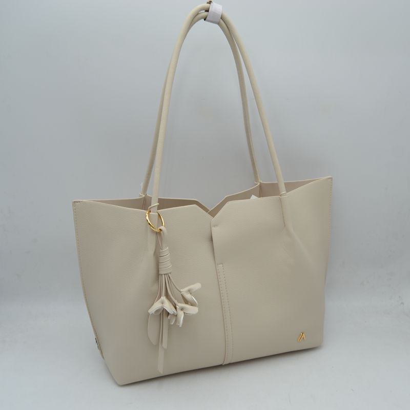 Minimalist Structured Tote Bag with Geometric Cutout and Tassel Accent
