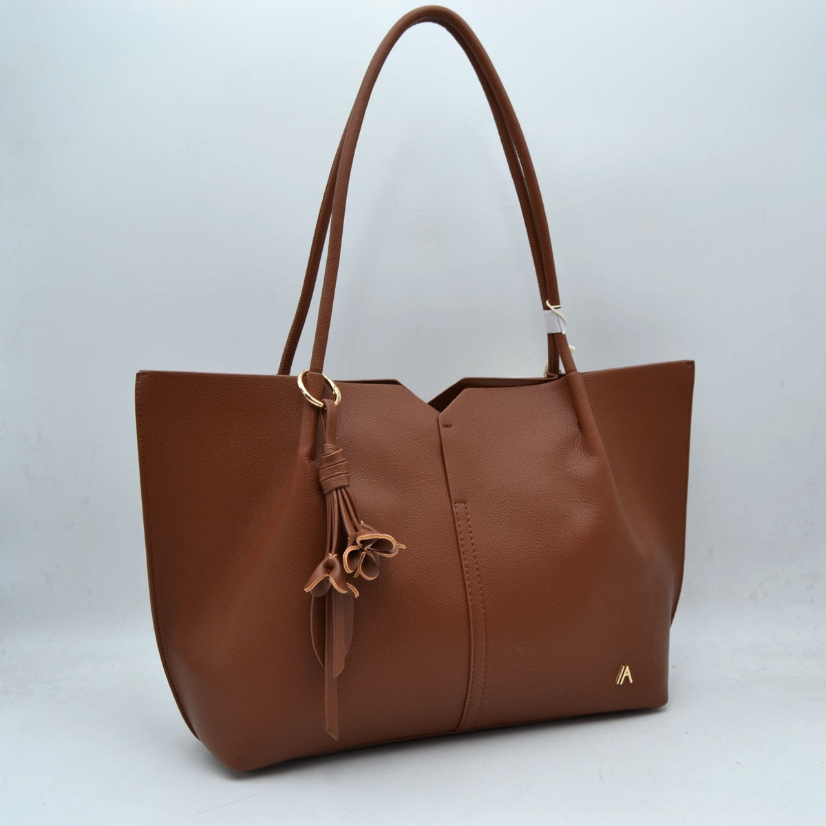 Minimalist Structured Tote Bag with Geometric Cutout and Tassel Accent