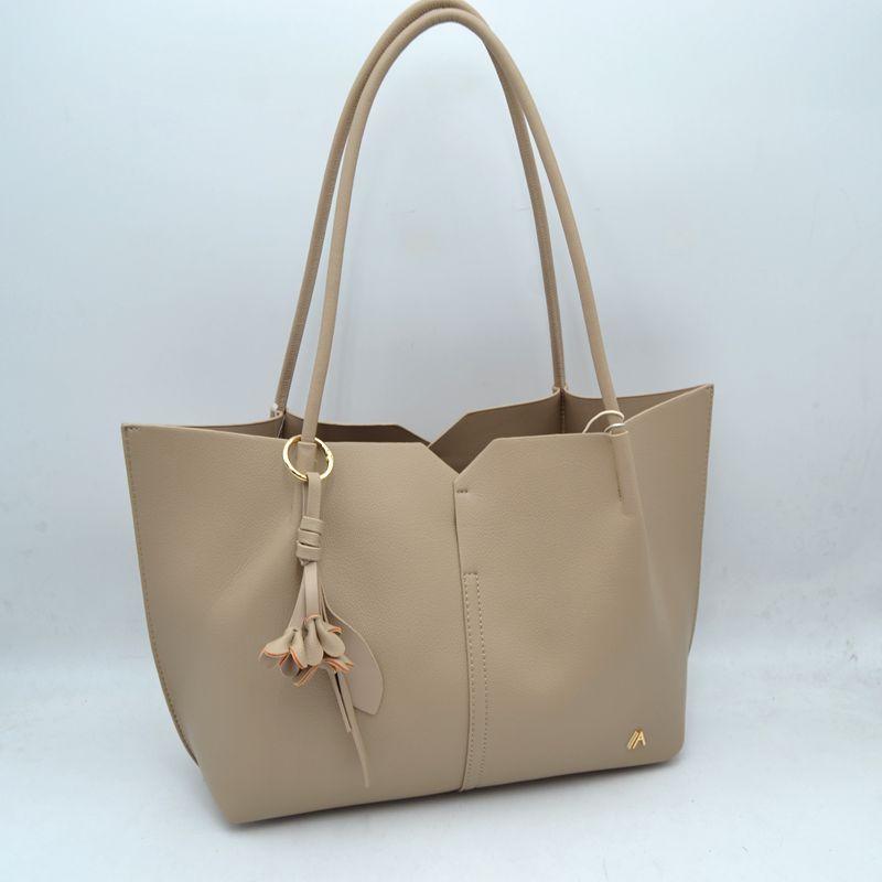 Minimalist Structured Tote Bag with Geometric Cutout and Tassel Accent