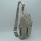 Grained Sling Bag with Metallic Zippers