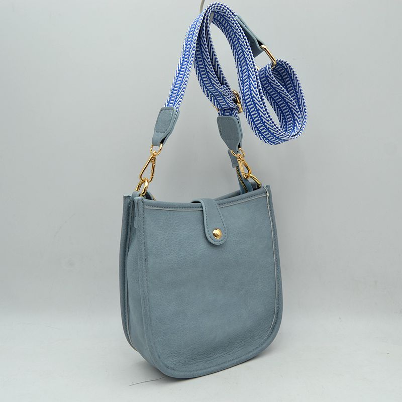 Minimalist Curved Crossbody Bag with Patterned Guitar Strap