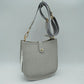 Minimalist Curved Crossbody Bag with Patterned Guitar Strap