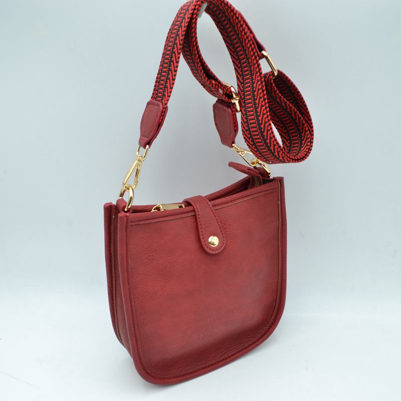 Minimalist Curved Crossbody Bag with Patterned Guitar Strap