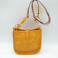 Minimalist Curved Crossbody Bag with Patterned Guitar Strap