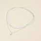 Collar superpuesto de cadena de espiga con colgante de dije de ráfaga de sol chapado en oro blanco