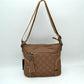 Quilted Nylon Crossbody Bag with Buckle Accents and Tassel Charm