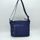 Quilted Nylon Crossbody Bag with Buckle Accents and Tassel Charm