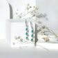 Pear Cut Emerald Dangle Earrings with Diamond