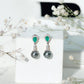 Pendientes de boda auténticos de perlas negras con esmeraldas y diamantes