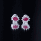 Genuine Oval Cut Ruby and Diamond Halo Stud Earrings