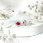 Genuine Oval Cut Ruby and Diamond Halo Stud Earrings