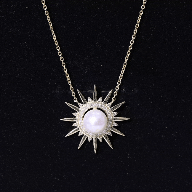 Collar con colgante en forma de sol con perla natural de agua dulce y diamantes