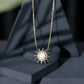 Collar con colgante en forma de sol con perla natural de agua dulce y diamantes