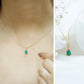 Pear Cut Emerald Solitaire Pendant with Diamond Accent Bail