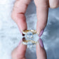 Anillo de compromiso solitario de moissanita octagonal con piedras laterales