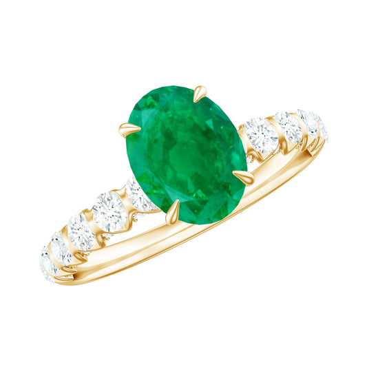 Anillo de compromiso ovalado de esmeralda natural de 1,2 quilates con diamantes laterales