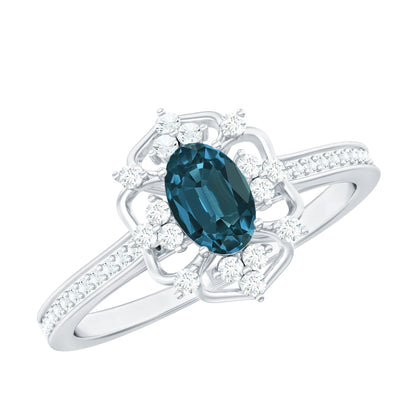 Anillo de compromiso vintage de topacio azul Londres talla ovalada de 0,4 quilates con diamantes