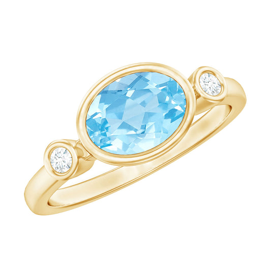Anillo de compromiso este-oeste de aguamarina y diamantes con engaste de bisel