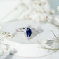Marquise Cut Lab Grown Blue Sapphire and Diamond Halo Engagement Ring