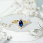 Marquise Cut Lab Grown Blue Sapphire and Diamond Halo Engagement Ring