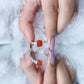 Anillo de compromiso de ópalo de fuego talla esmeralda de 1 quilate con diamantes laterales