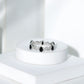 Pear Shaped Black Onyx and Diamond Crossover Wedding Band