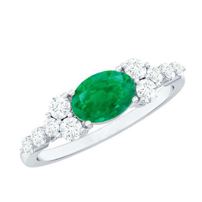 Anillo de compromiso de esmeralda talla ovalada de 0,7 quilates con diamante