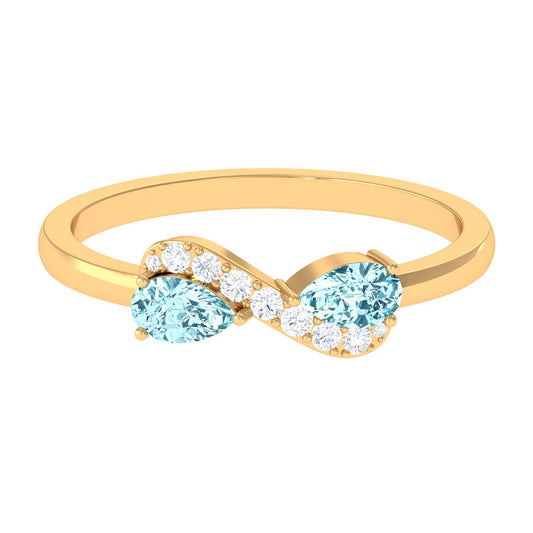 Anillo de promesa Infinito de aguamarina en forma de pera de 0,7 quilates con diamante