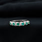 Anillo de boda de diseño para mujer con esmeraldas y diamantes