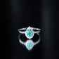 Anillo de compromiso de esmeralda talla pera con diamantes con motivos naturales