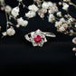 Natural 0.6 Carat Ruby Flower Engagement Ring with Diamond Bypass Shank