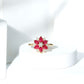 Anillo de compromiso de flor con diamantes y rubí de forma de pera natural para mujer
