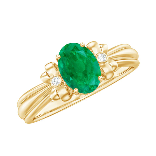 Anillo de compromiso solitario con esmeralda talla oval y diseño de lazo